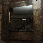 A mirror/lamp by Marc Moss